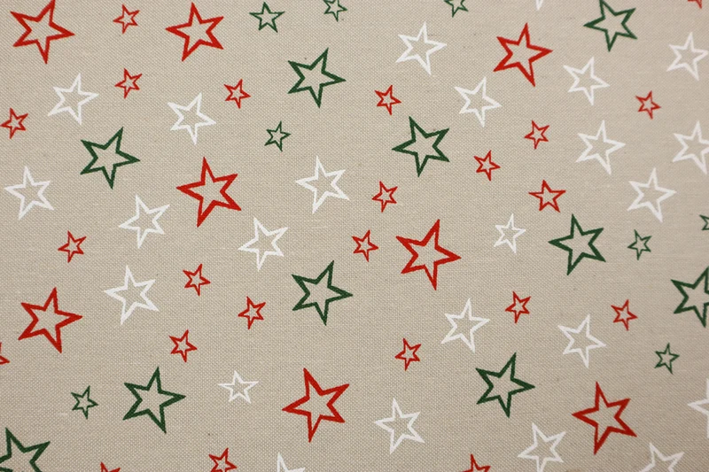 Dekostoff Weihnachtssterne grün/rot/weiß