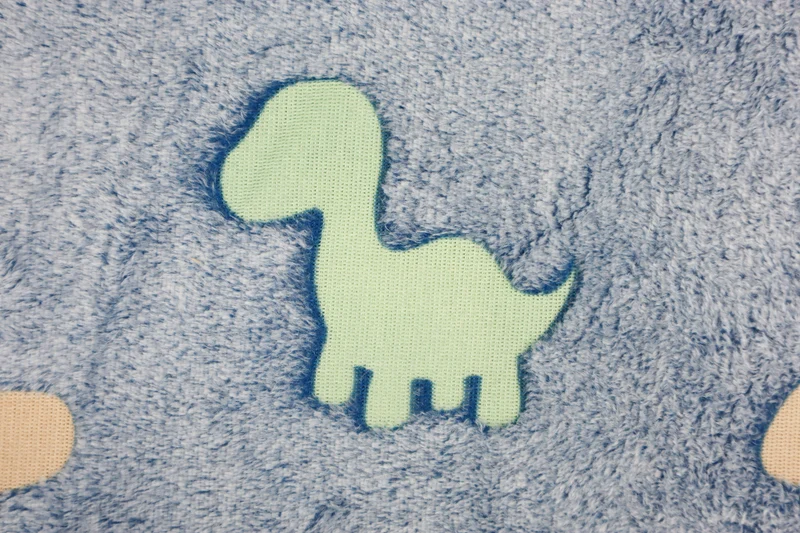Wellnessfleece Glow in the Dark Dinosaurier
