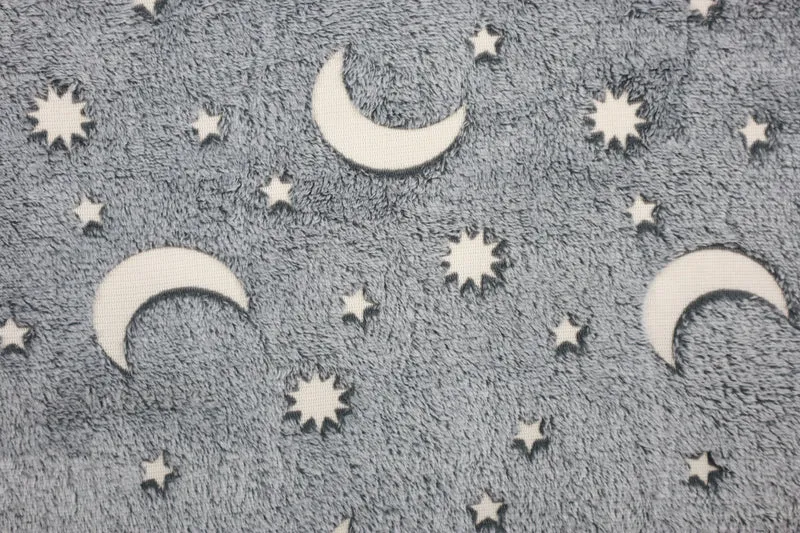 Wellnessfleece Glow in the Dark Sonne, Mond + Sterne