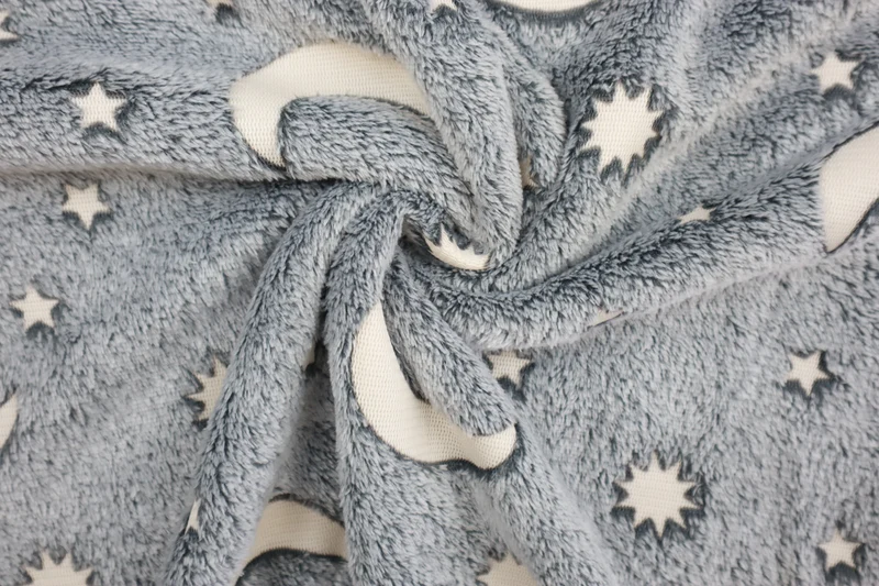 Wellnessfleece Glow in the Dark Sonne, Mond + Sterne