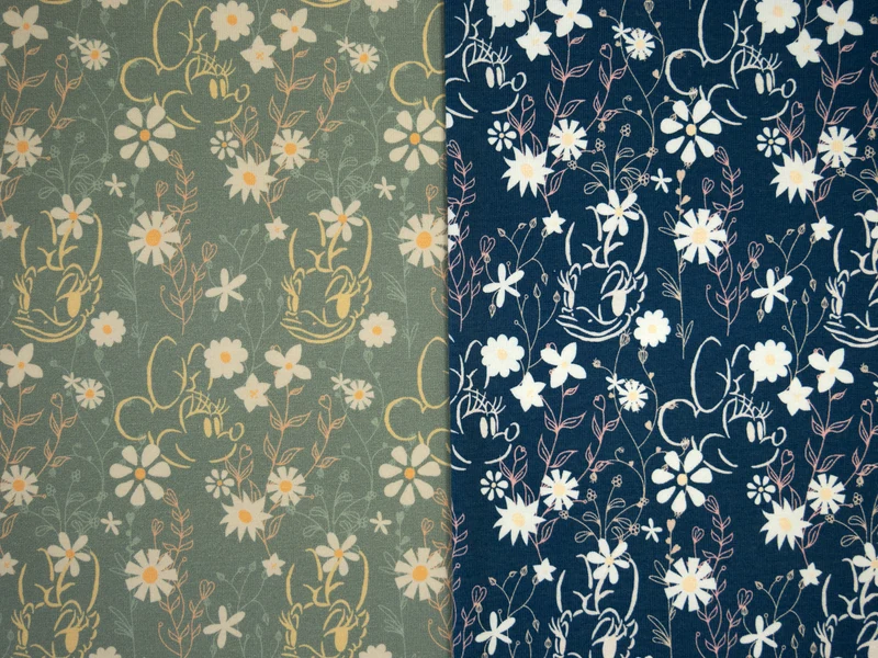 Lizenz Baumwolljersey Disney Minnie & Daisy Flowerfield