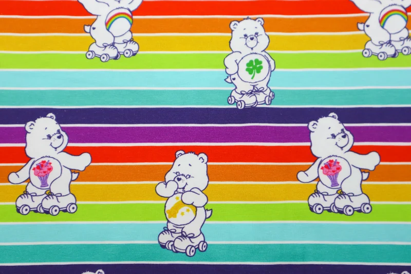 Baumwolljersey Lizenz Glücksbärchis Regenbogenstreifen